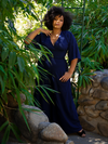 Ashleeta posing while wearing the Black Widow Palazzo Pants in Navy.