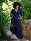 Looking off-camera, Ashleeta has her hands firmly tucked into her Black Widow Palazzo Pants in Navy.