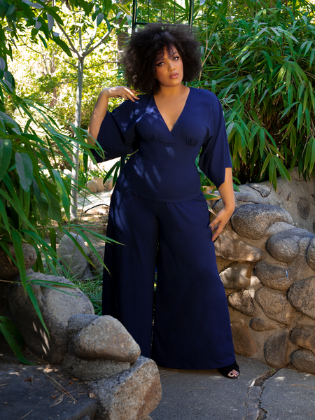 Ashleeta showing off her gothic glamour outfit featuring the Black Widow Palazzo Pants in Navy and matching flowing top.