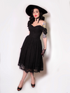 Micheline Pitt standing proudly modeling the Southern Gothic skirt in black petite by La Femme En Noir.