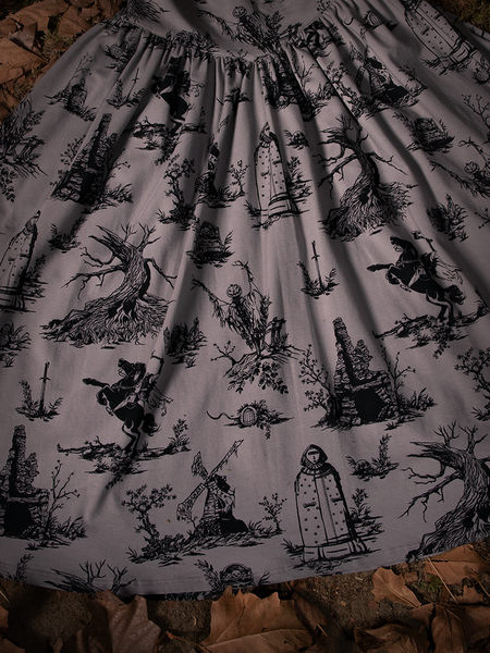 Close up of the pattern on the Sleepy Hollow Gothic Tales Toile Swing Dress in Grey.