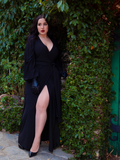 Model Rachel Sedory wearing the Black Widow Wrap Gown in Solid Black from La Femme en Noir.